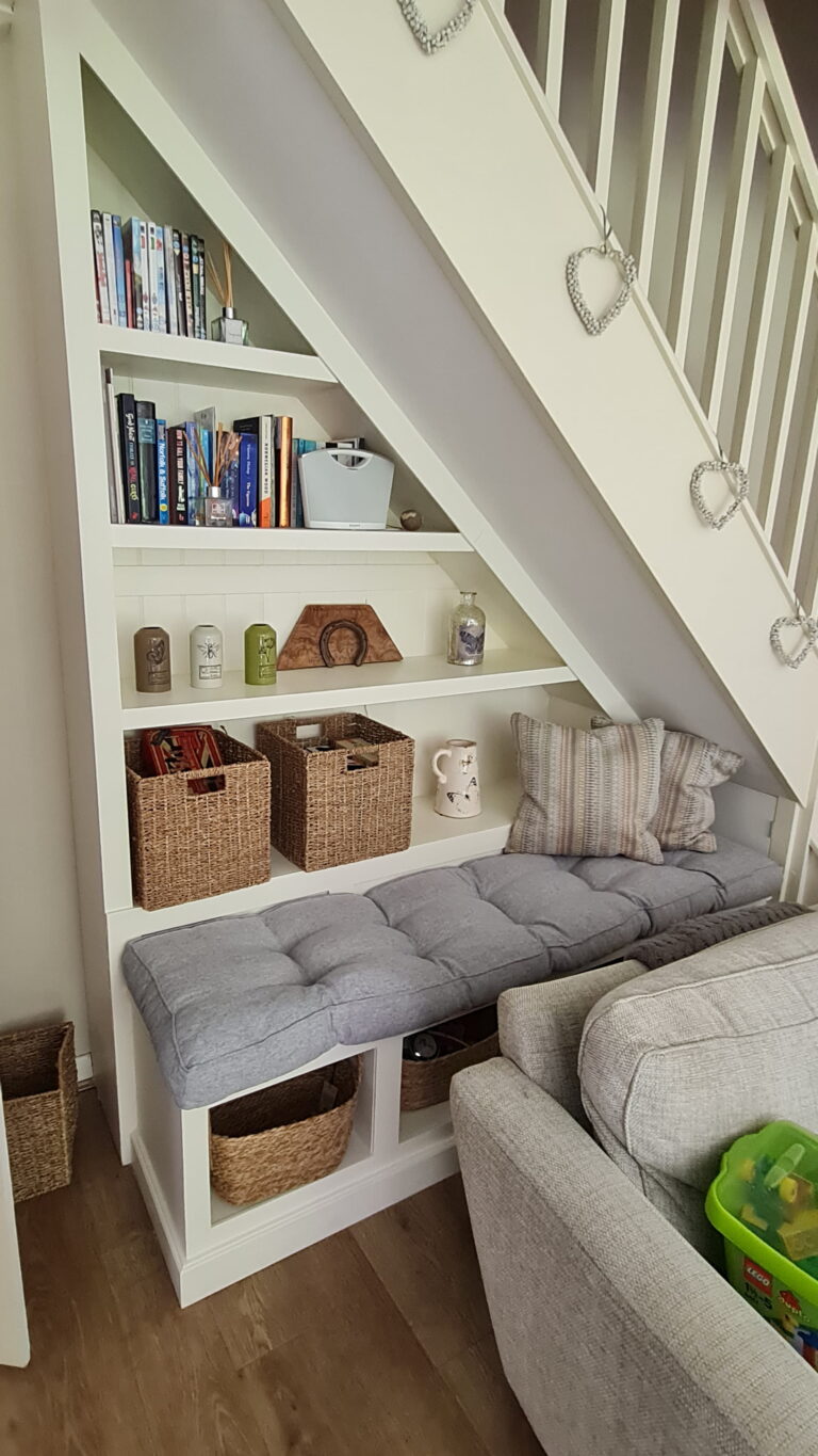 Beautifully finished and functional storage space under staircase